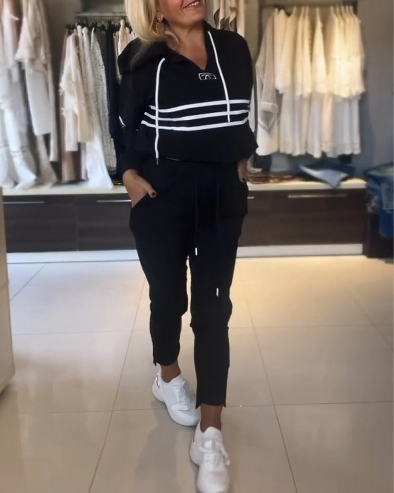 Lässiges kapuzenpullover-set mit streifenmuster