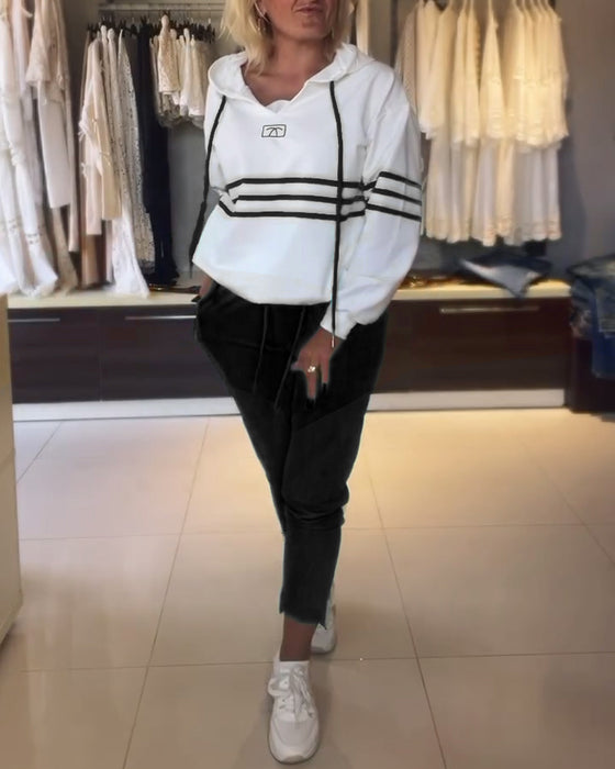 Lässiges kapuzenpullover-set mit streifenmuster