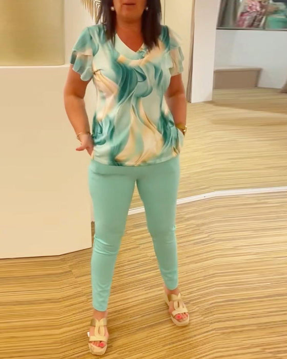 Bedruckte Bluse mit V-Ausschnitt und Rüschenärmeln im Patchwork-Stil