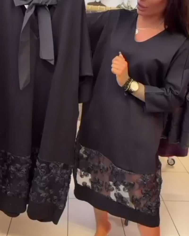 Stilvolles Kleid mit Schleife auf dem Rücken und V-Ausschnitt