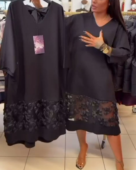 Stilvolles Kleid mit Schleife auf dem Rücken und V-Ausschnitt