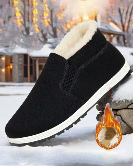 Herrenschuhe aus Baumwolle mit superwarmem Futter aus Kunstfell und rutschfester Sohle.
