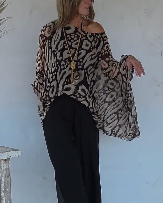 Langärmlige Bluse mit unregelmäßigem Fledermaus-Print