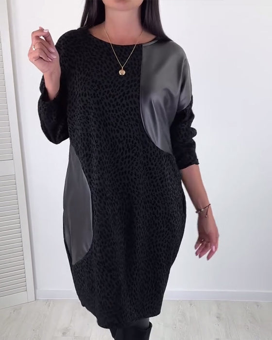 Elegantes kleid mit rundhalsausschnitt und einsätzen