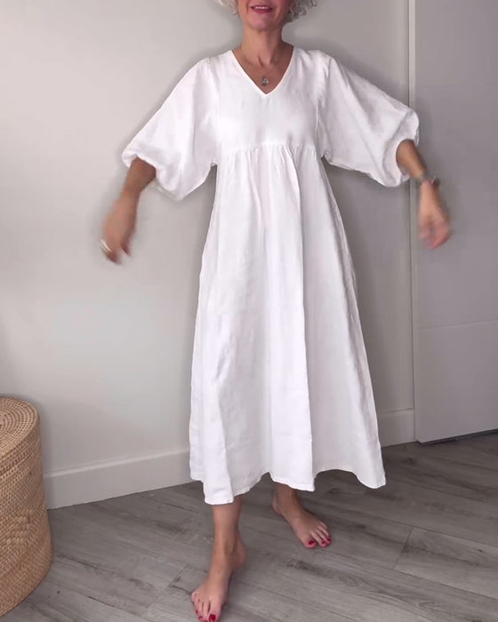 Lässiges, einfarbiges kleid mit V-ausschnitt und laternenärmeln