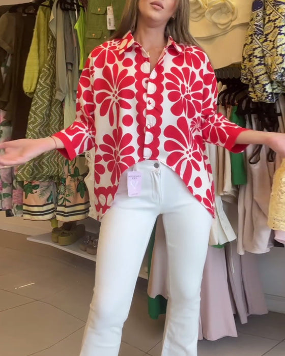 Geblümte bluse mit unregelmäßigem saum und revers