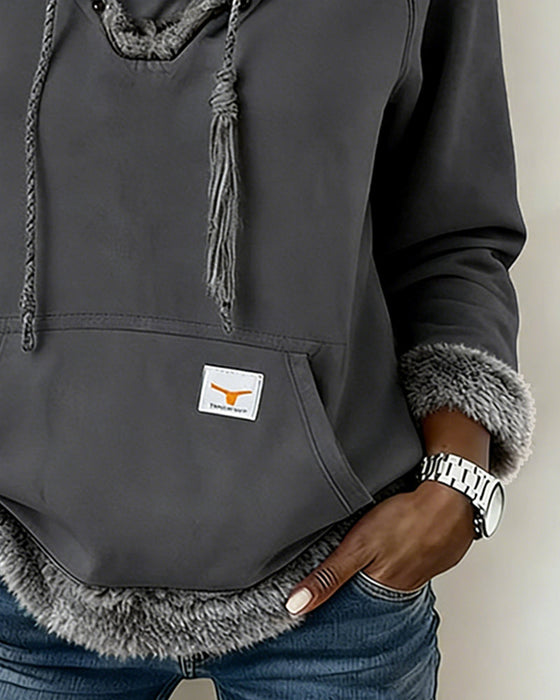 Langärmliges Sweatshirt mit Patchwork-Details und Tasche