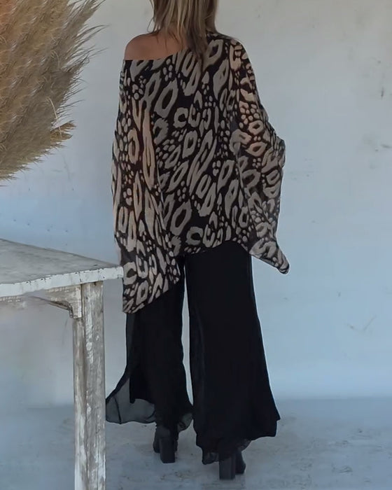 Langärmlige Bluse mit unregelmäßigem Fledermaus-Print