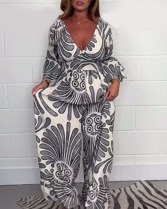 Lockerer jumpsuit mit tiefem v-retro-print und glockenärmeln