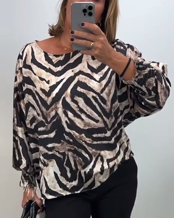 Lässige bluse mit rundhalsausschnitt und laternenärmeln im zebra-print