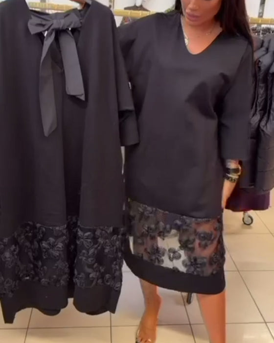 Stilvolles Kleid mit Schleife auf dem Rücken und V-Ausschnitt