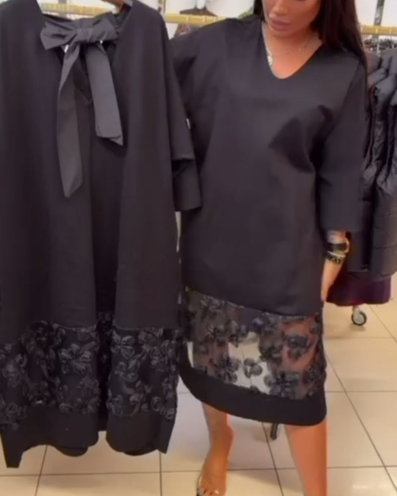 Stilvolles Kleid mit Schleife auf dem Rücken und V-Ausschnitt