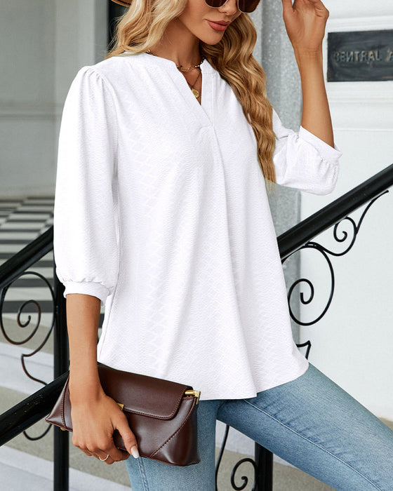 Einfarbige Jacquard-Bluse mit V-Ausschnitt