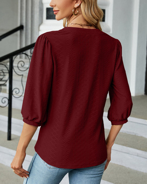 Einfarbige Jacquard-Bluse mit V-Ausschnitt