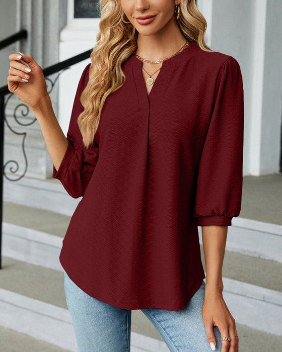 Einfarbige Jacquard-Bluse mit V-Ausschnitt