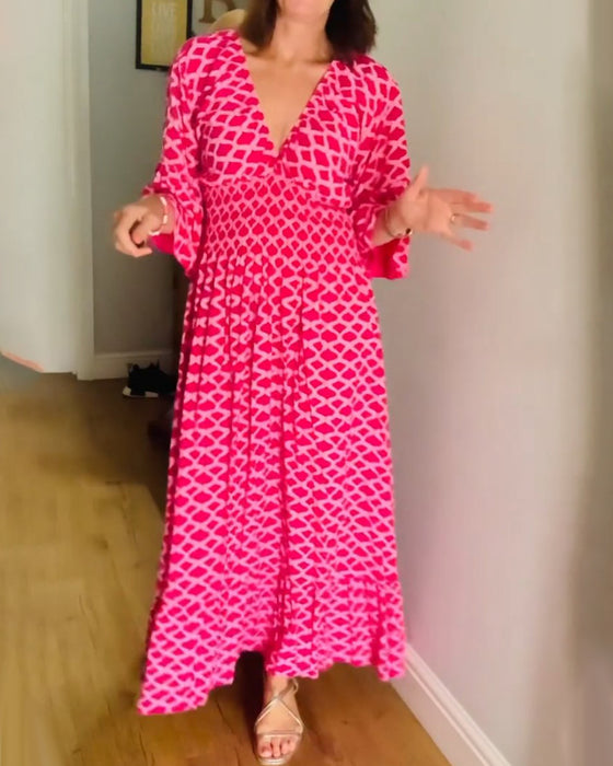 Elegantes Kleid mit geometrischem Print und V-Ausschnitt